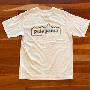 Patagonia Cream Tee with Multicolor Mountain Logo